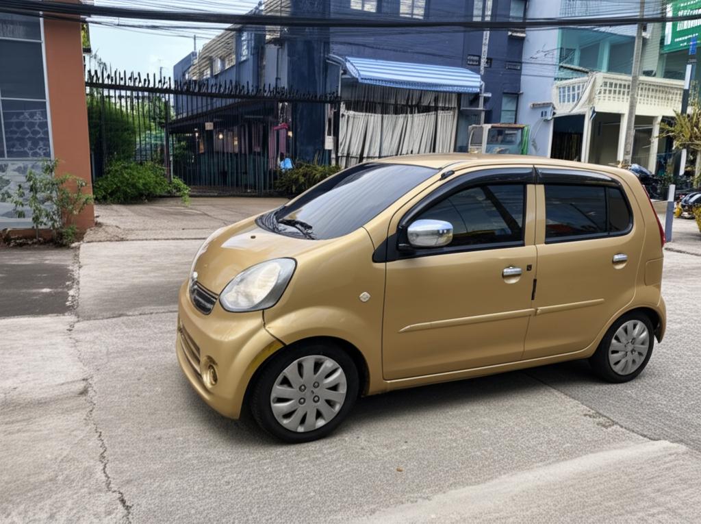 A small, slightly worn daily driver car parked on a street in Thailand
