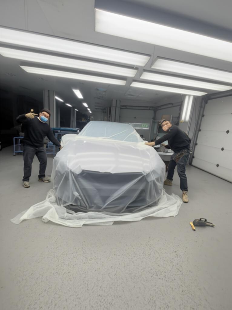 Car being prepped for a new wrap after removal of old film