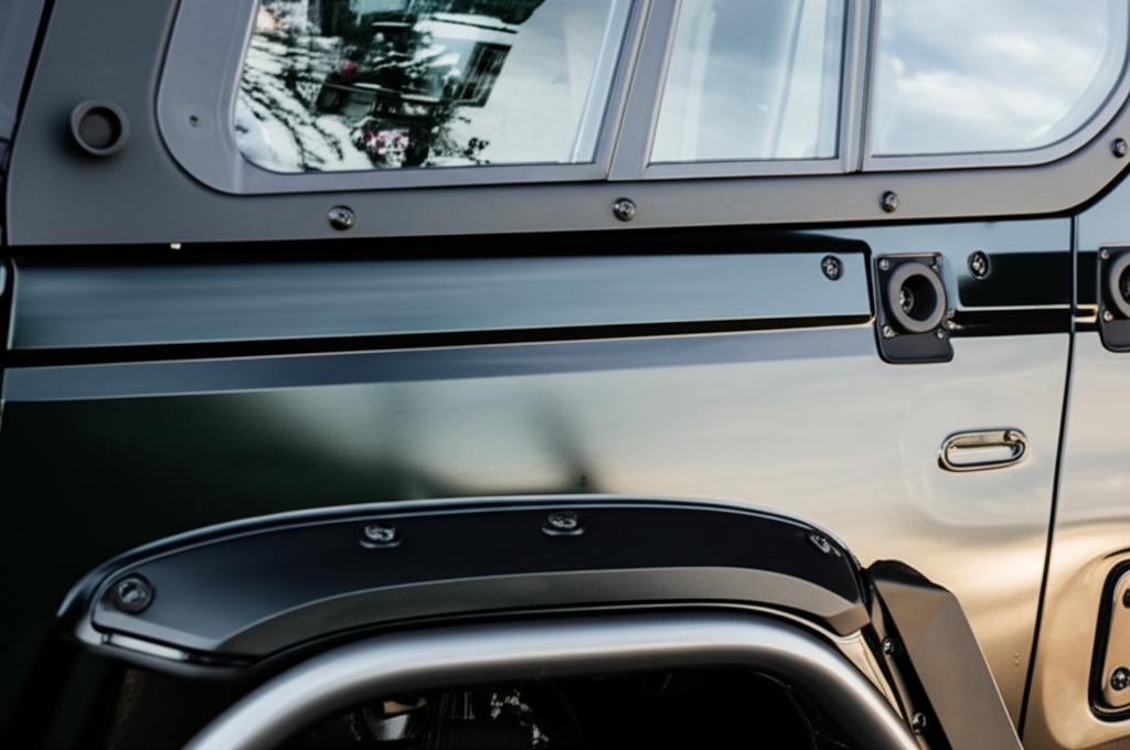 Close-up of a protected SUV panel showing a high-gloss finish