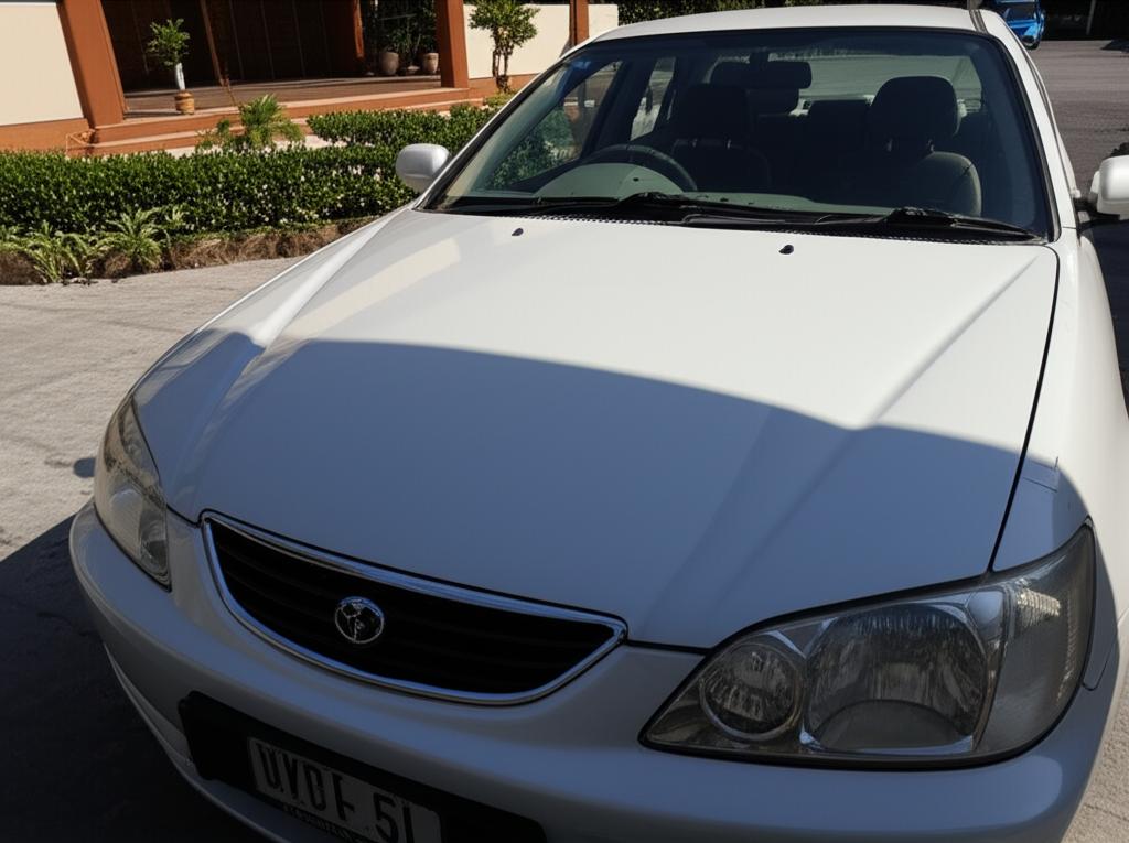 Car parked under harsh Thai sun showing potential paint fade